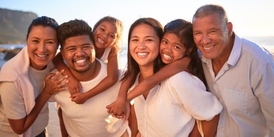 Multigenerational family smiling together outdoors